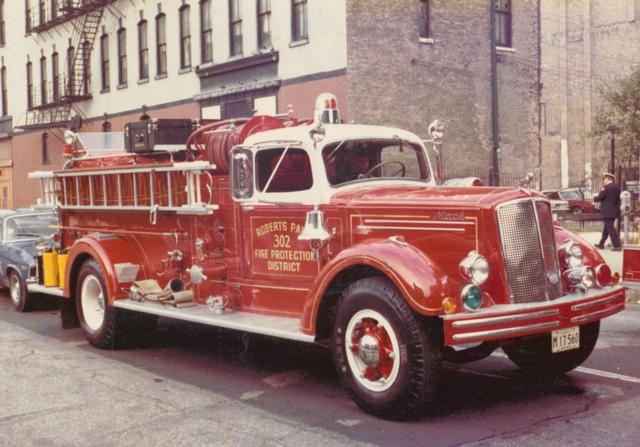 Engine 302. Seen here with the roof painted white. This white-over-red color scheme is still in use today on Roberts Park fire trucks.